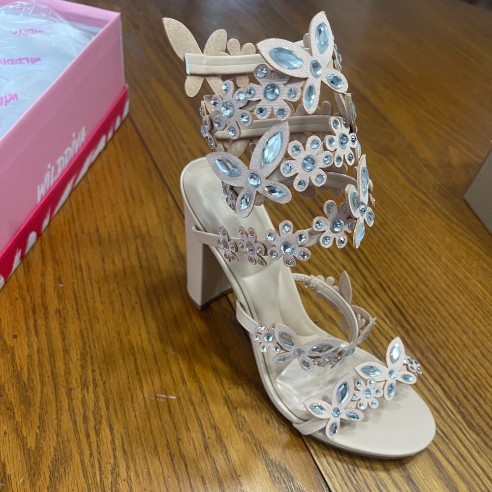 Nude heels with rhinestones that wrap up the leg